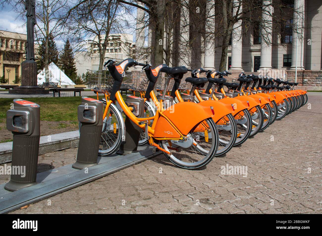 Row of bikes parked for hire, city bikes rent parking, public bicycle  sharing system, bike sharing program, green economy Stock Photo - Alamy
