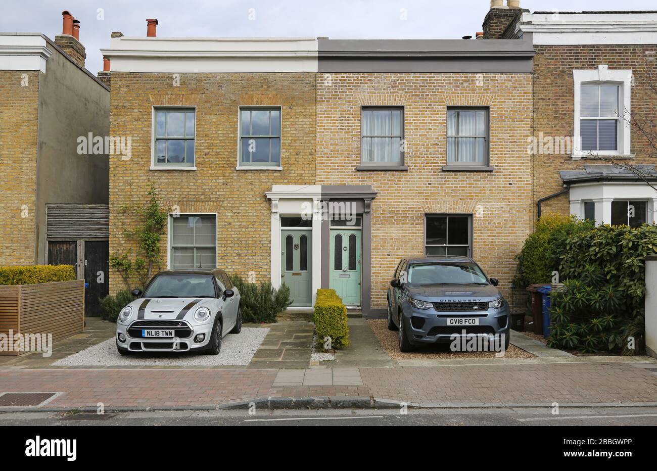 Victorian houses in South London that have converted their front gardens to allow car parking - avoiding council street parking permit charges. Stock Photo