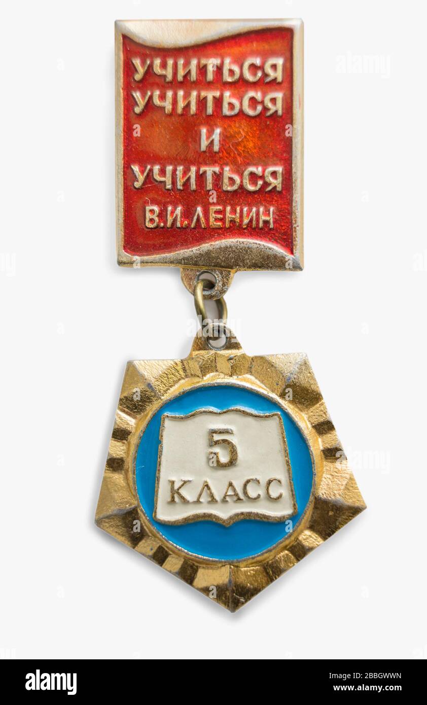 Moscow, Russia - Mar 26, 2020.: Soviet badge of school student. Inscription: Learn to learn and learn. V.I. Lenin. On suspension inscription: 5th grad Stock Photo
