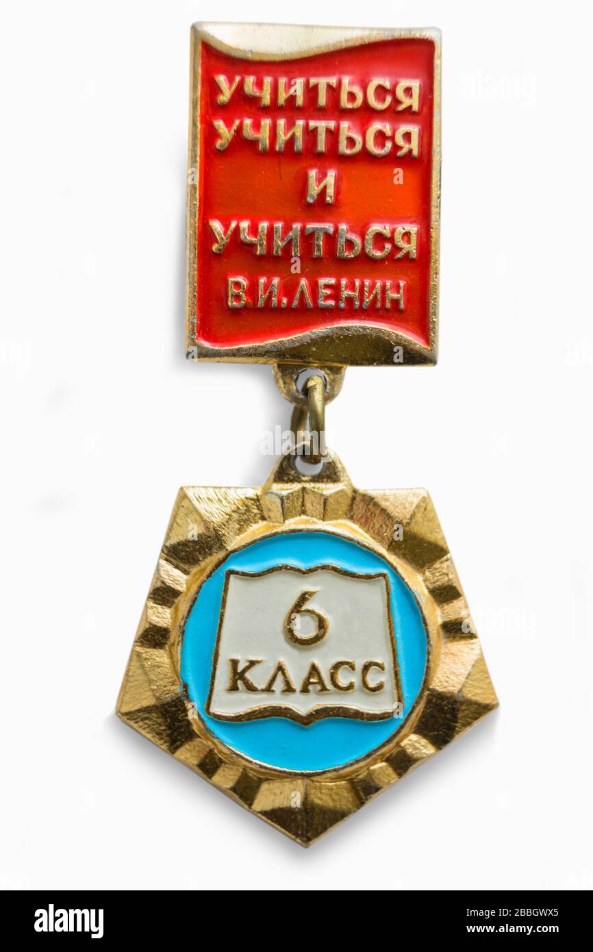 Moscow, Russia - Mar 26, 2020.: Soviet badge of school student. Inscription: Learn to learn and learn. V.I. Lenin. On suspension inscription: 6th grad Stock Photo