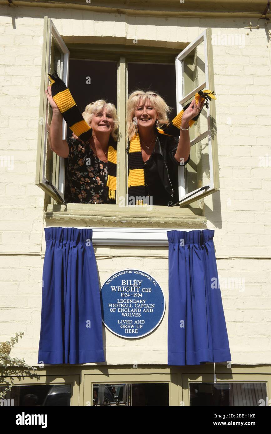 Vicky and Babette the daughters of English footballing legend Billy Wright unveil a plaque on the house in New Road, Ironbridge where Billy lived as a child. Billy played all his career at Wolverhampton Wanderers and was the first player in the world to play more 100 games for his country when got 105 caps for England. He married Joy Beverley of The Beverly Sisters in 1958 and they became the golden couple of the 1950s. Stock Photo