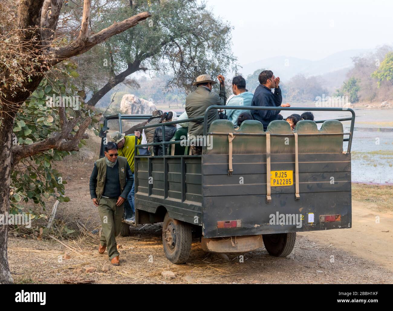 Tourists in a Canter safari vehicle on a Tiger Safari in Ranthambore National Park, Rajasthan, India Stock Photo