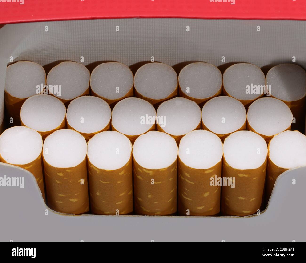 many cigarettes in a packet just opened by the avid smoker Stock Photo
