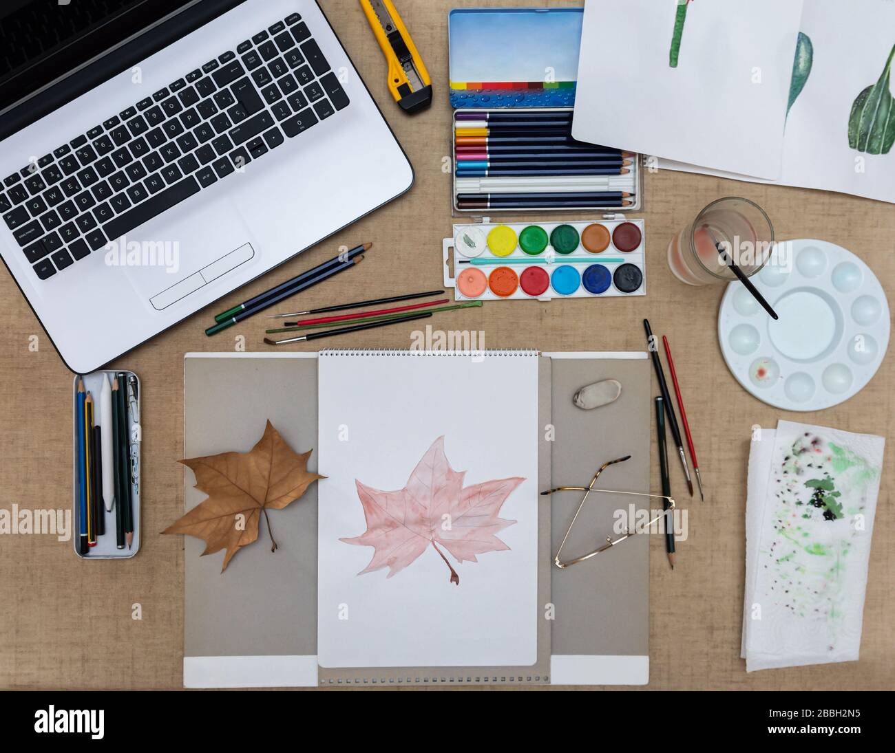 Material to paint with watercolors, copying an autumn leaf, overhead view Stock Photo