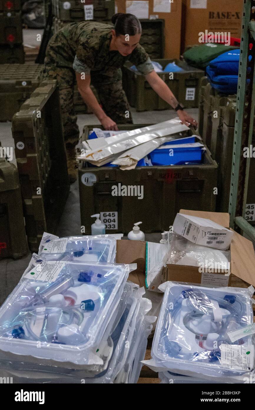 Camp Lejeune, United States. 31st Mar, 2020. U.S. Navy Sailors with 2d Medical Logistics Company, 2d Supply Battalion, 2d Marine Logistics Group, load medical kits on Camp Lejeune, North Carolina, on March 18, 2020. The Sailors are preparing kits to provide for national coronavirus (COVID-19) aid alongside II Marine Expeditionary Force and will include hand sanitizer gel, surgical masks, disinfectant wipes, latex gloves, sphygmomanometers, stethoscopes, thermometers, and isolation gowns. Photo by Cpl. Rachel K. Young-Porter/U.S. Marine Corps/UPI Credit: UPI/Alamy Live News Stock Photo