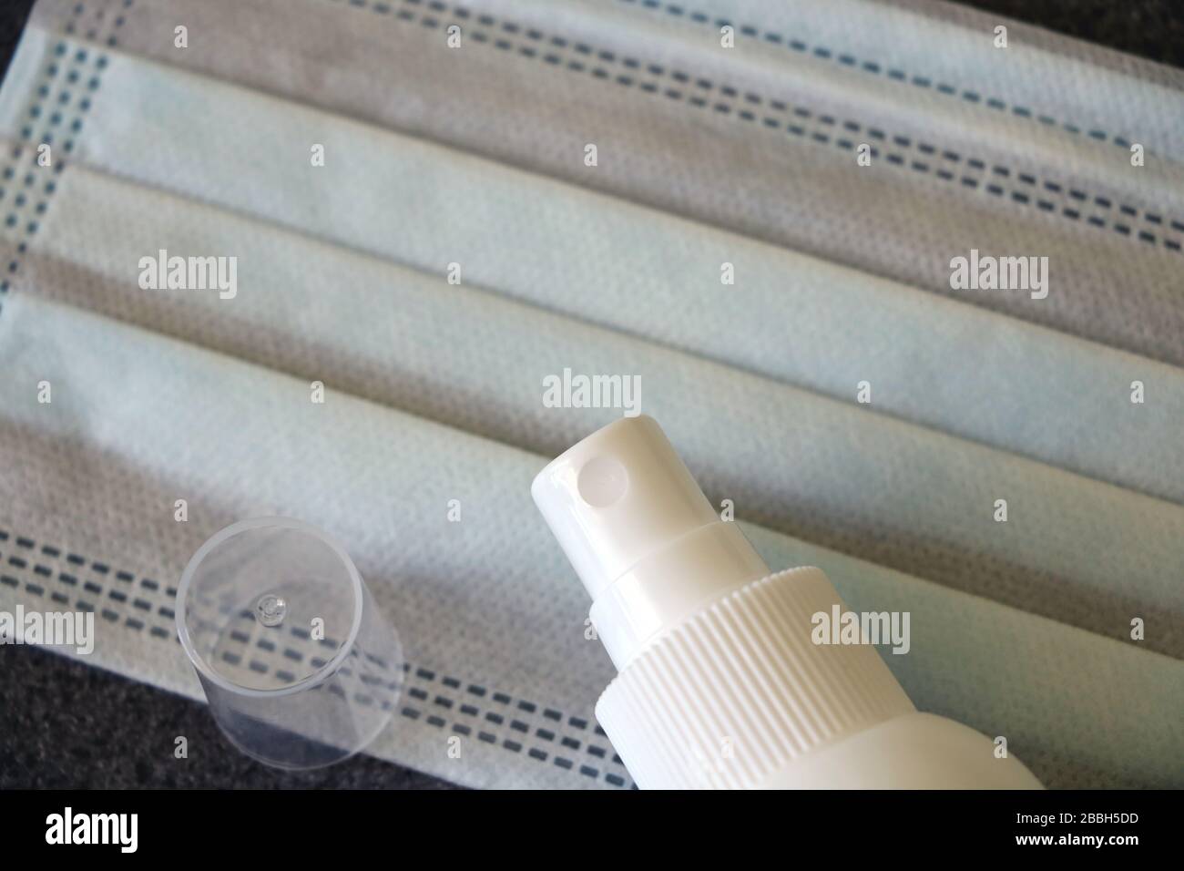 Novel coronavirus disease named 2019-nCoV handwriting on paper with breathing mask and pill,selective focus on handwriting text Stock Photo