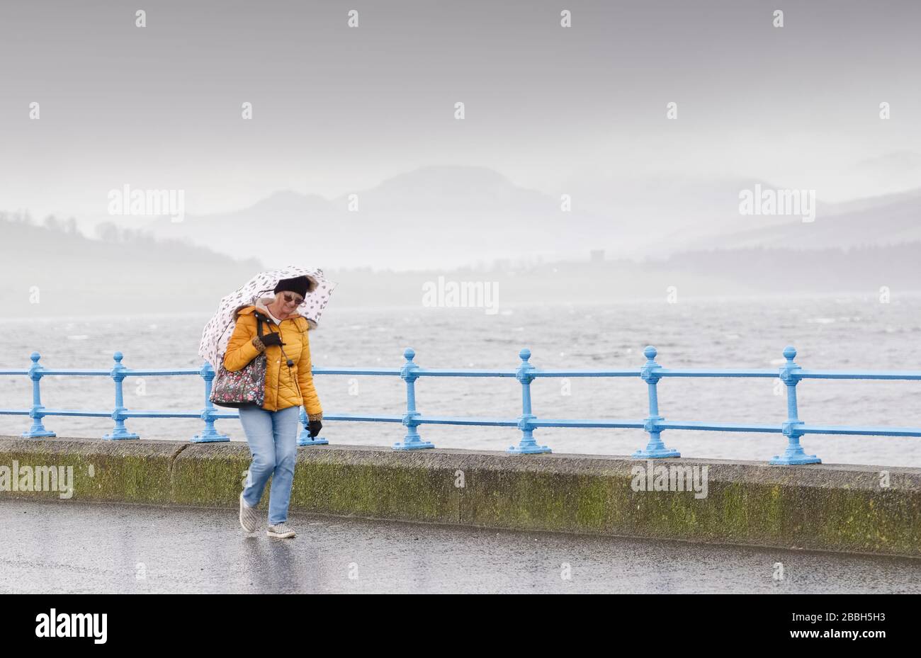 Greenock, Scotland / UK - February 20th 2020: People walking along coastal path during Storm Ciara Stock Photo