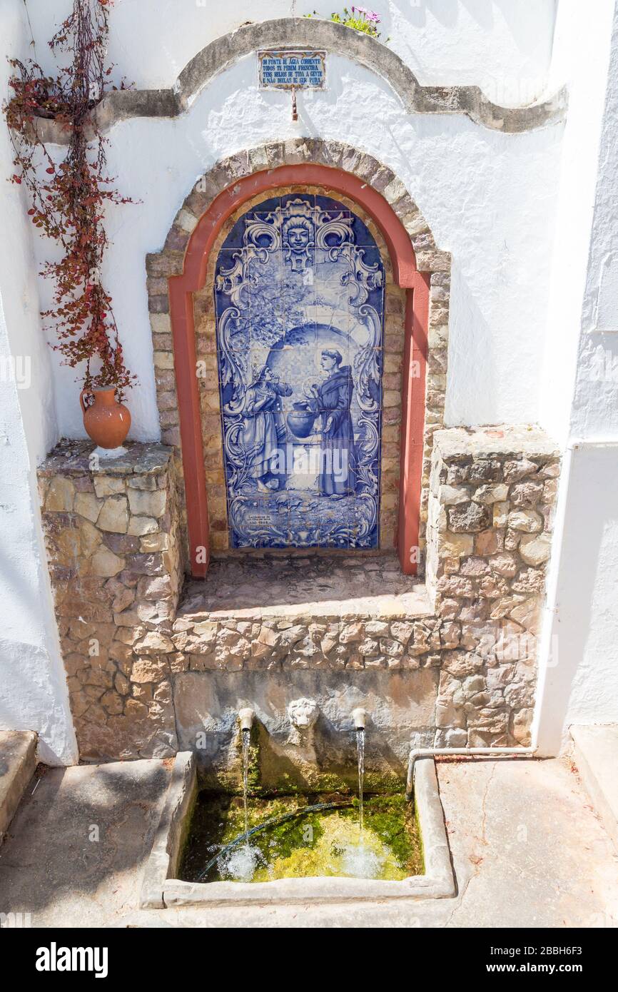 Spring with painted tiles at the Fonte Peguena, Little Fountain, Alte, Portugal Stock Photo