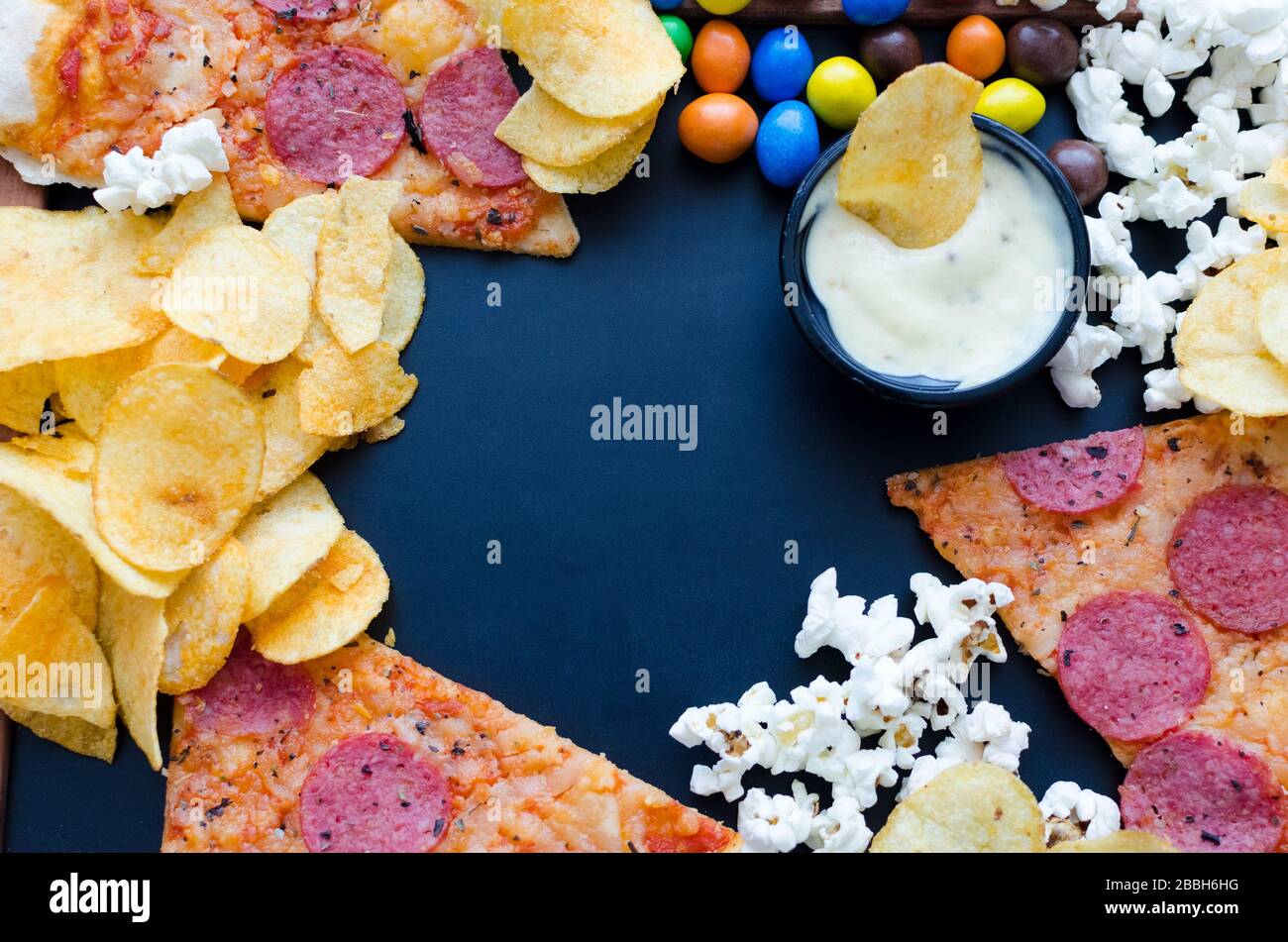 Fast food and unhealthy eating concept. Close up of fastfood snacks