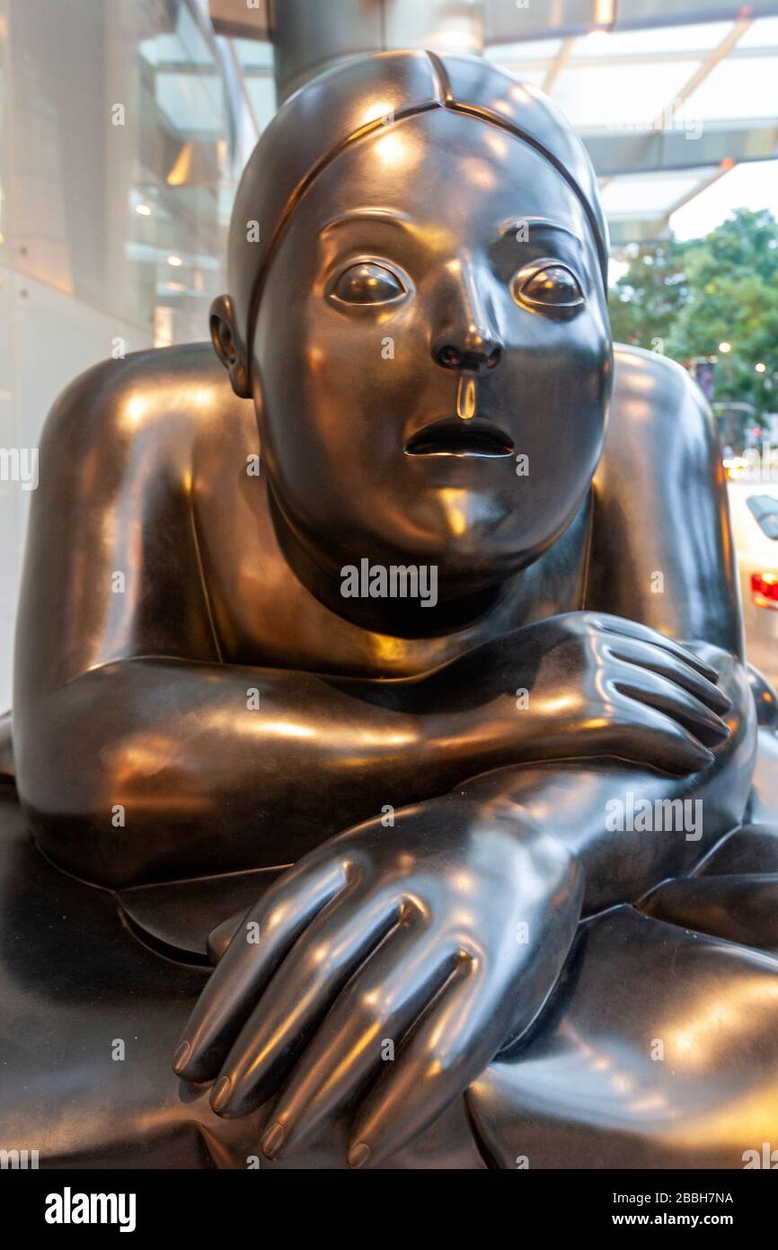 Monumental sculpture of a reclining woman by Fernando Botero, display at the St Regis Hotel, Singapore Stock Photo