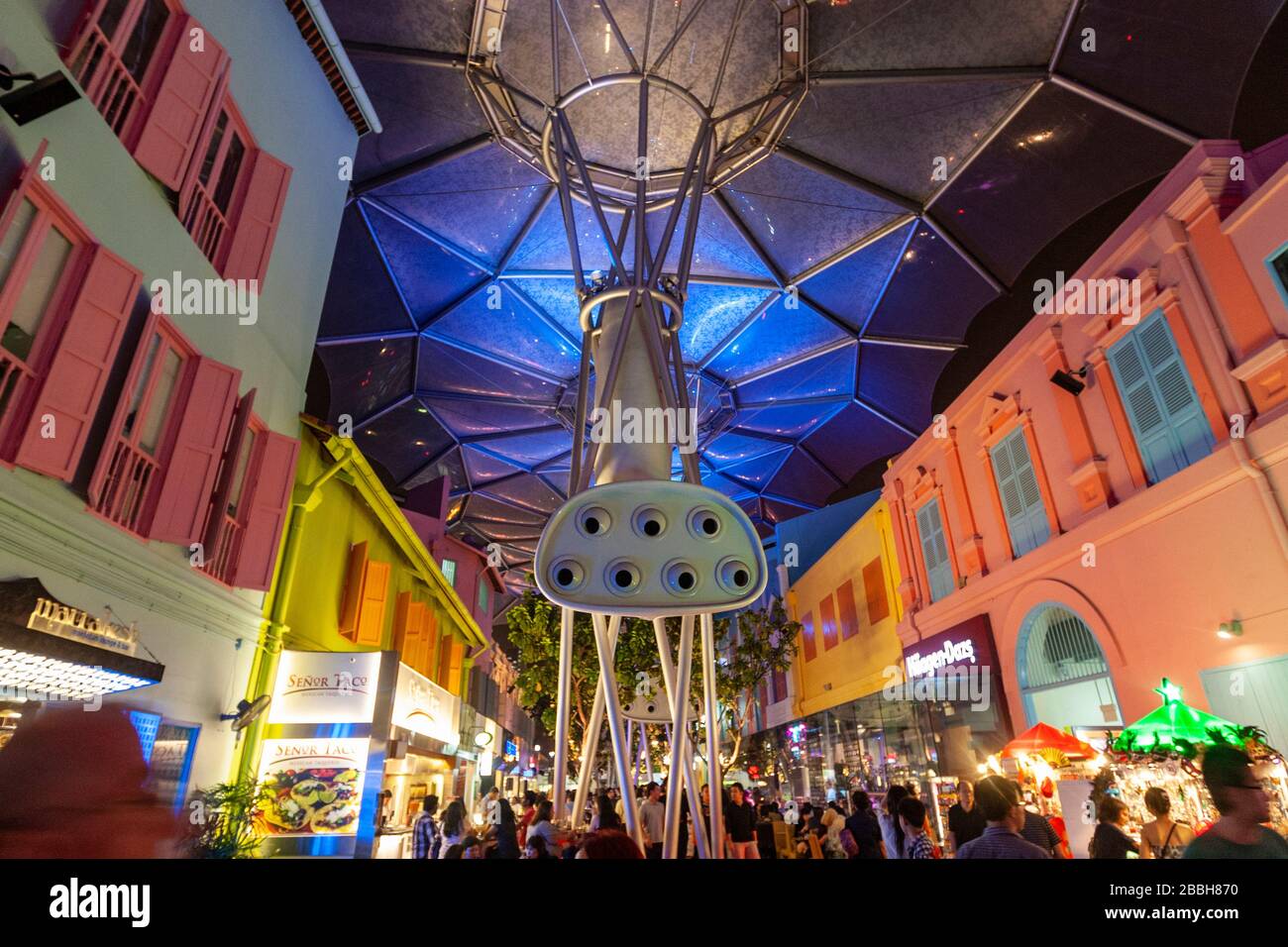 Clarke Quay, blocks of restored 19th century shophouses and warehouses under a multi-colored illuminated canopy, Singapore Stock Photo