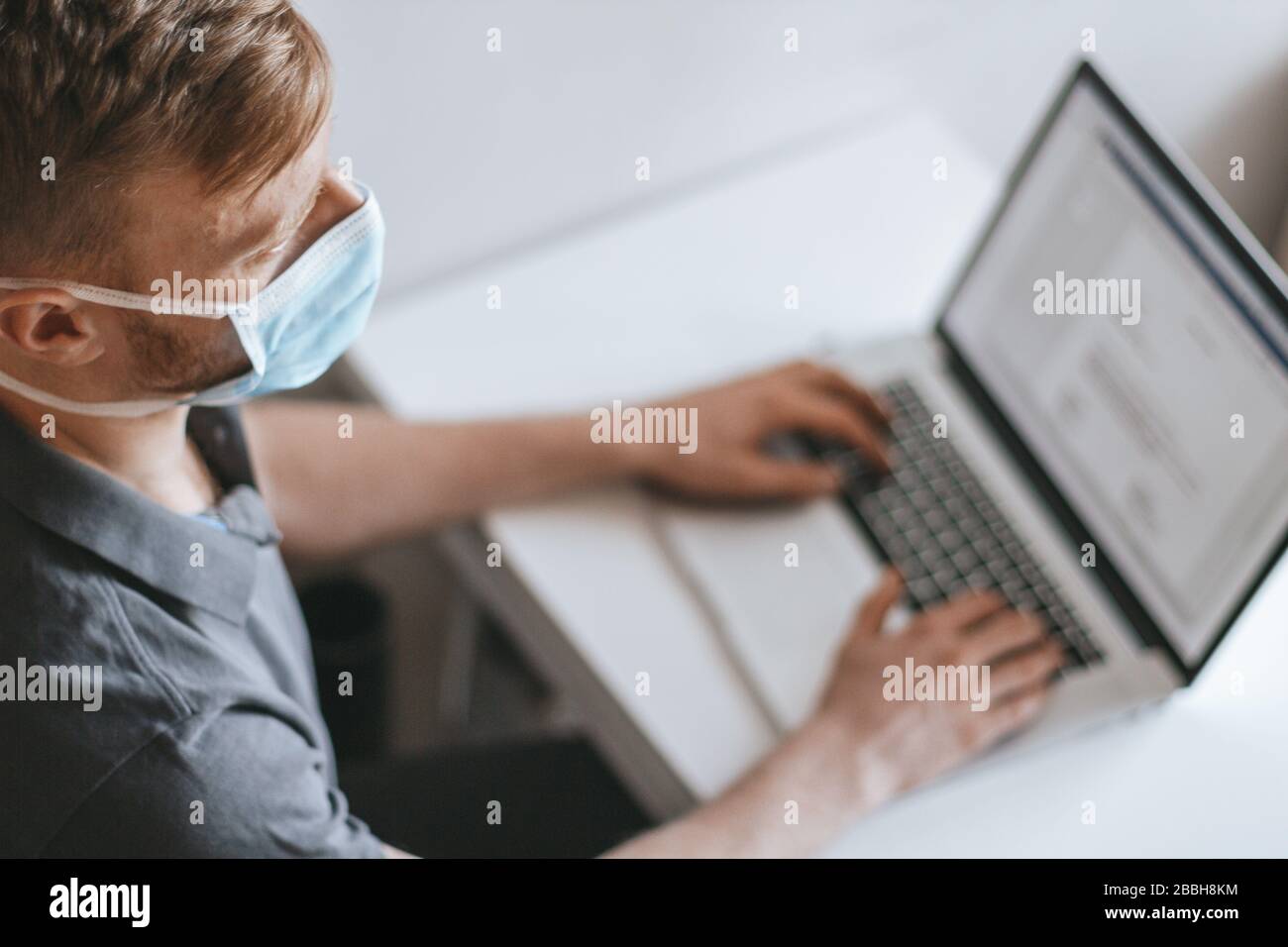 Portrait of a young man with surgical mask on Stock Photo - Alamy