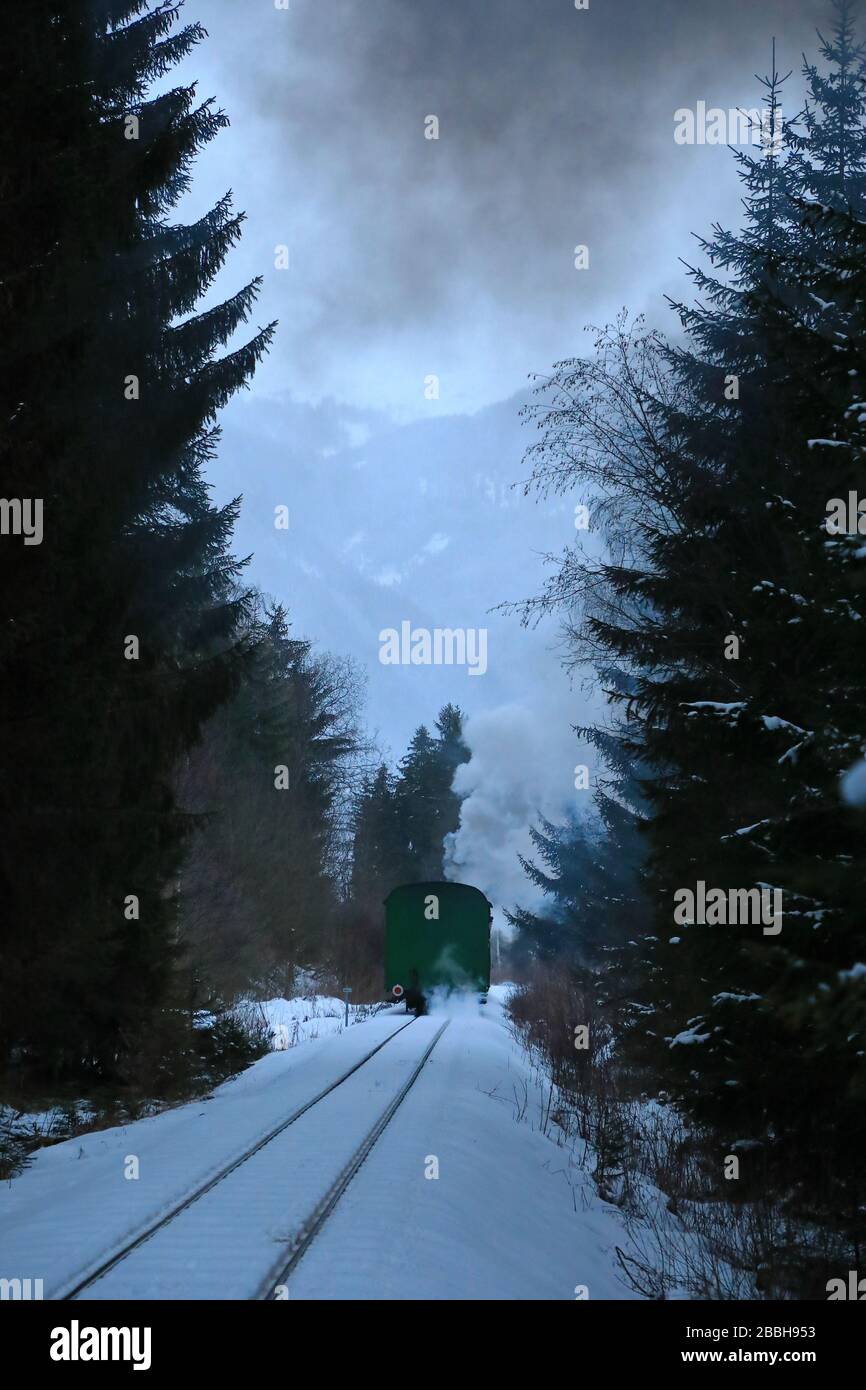 Steam train in winter near Mauterndorf, Austria Stock Photo