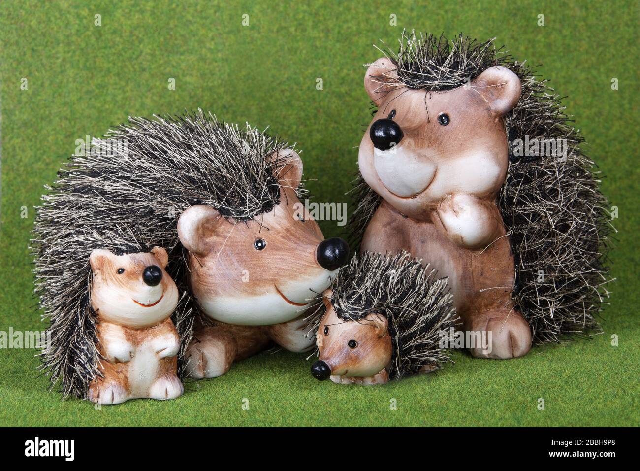 Family of cute toy Hedgehogs together on grass Stock Photo Alamy