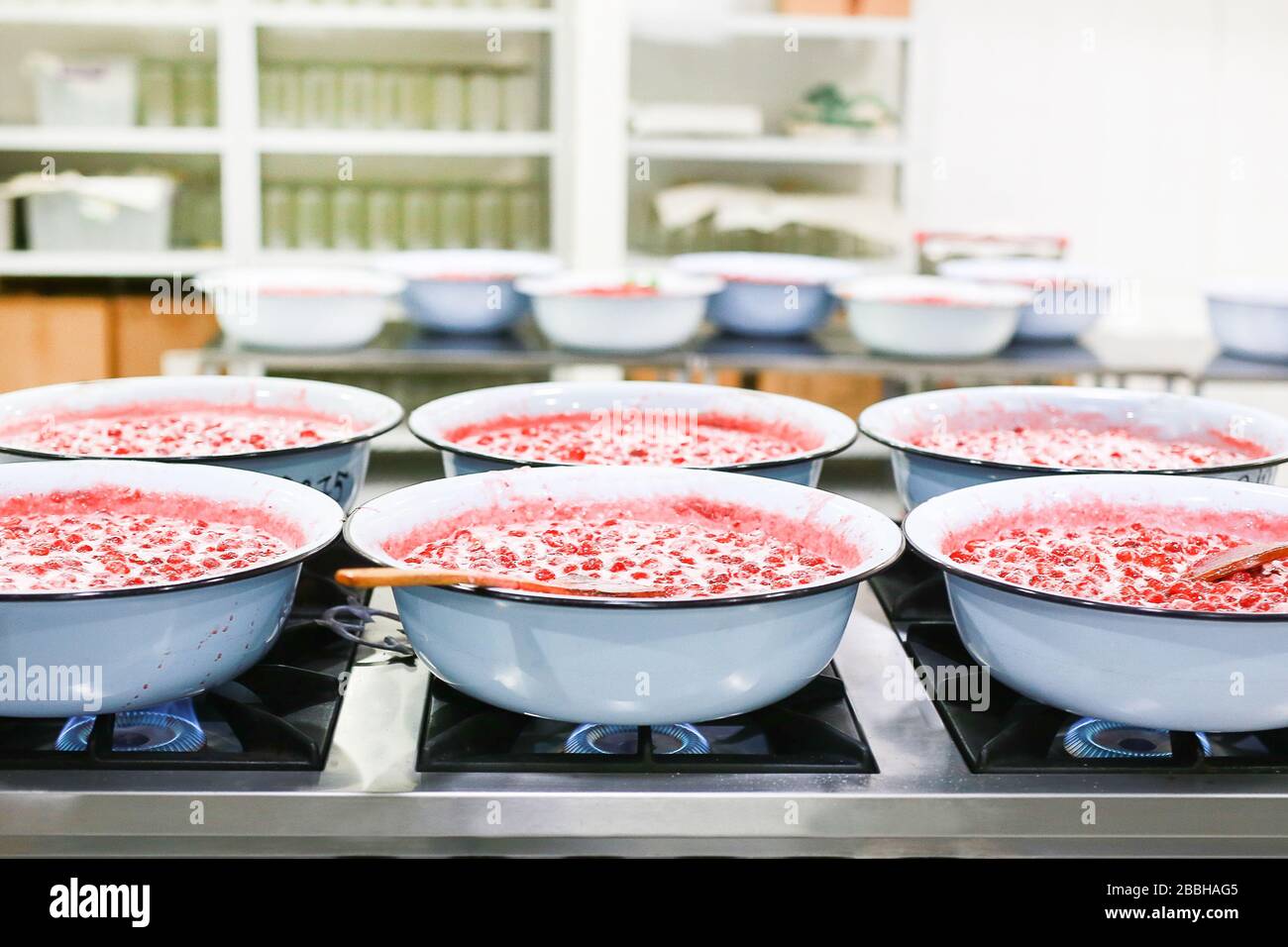 Strawberry jam cooking process. Organic traditional jam manufacturing