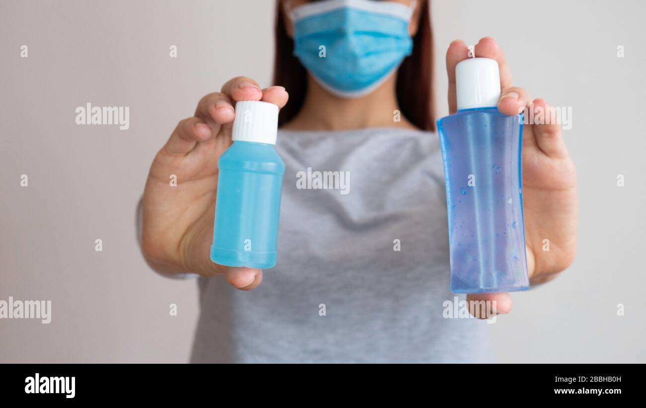 Woman Holding Two Bottles High Resolution Stock Photography and Images ...