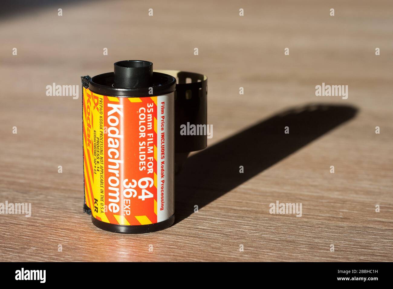 Classic roll of Kodachrome 64, 35mm slide film on a table Stock Photo
