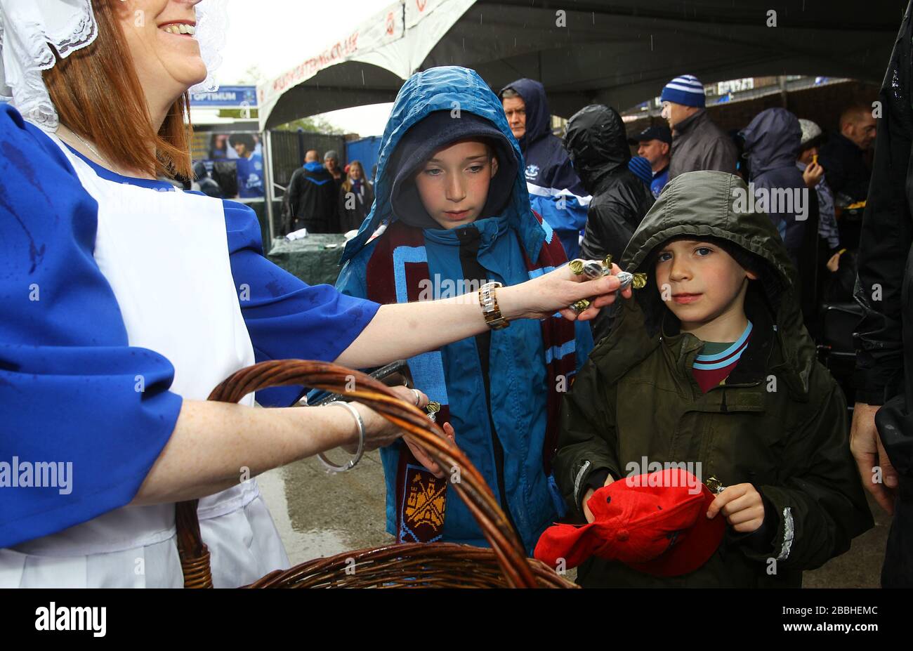 The Everton toffee lady with fans outside Goodison Park before the