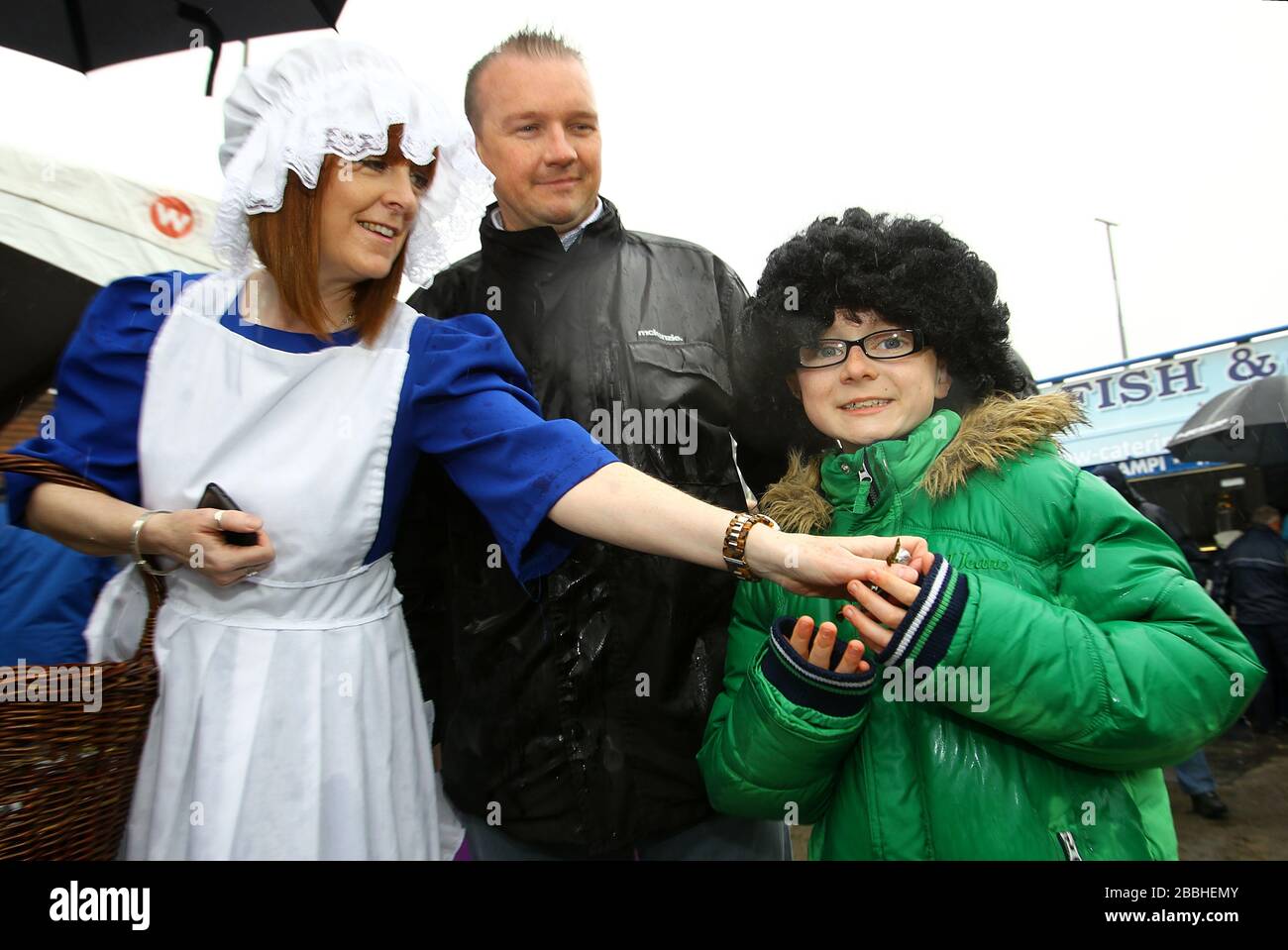 The Everton toffee lady with fans outside Goodison Park before the