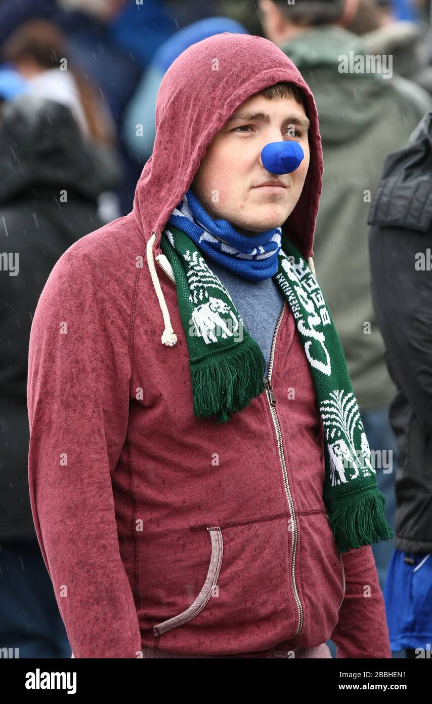 A Everton fan wearing a blue nose outside Goodison Park before the
