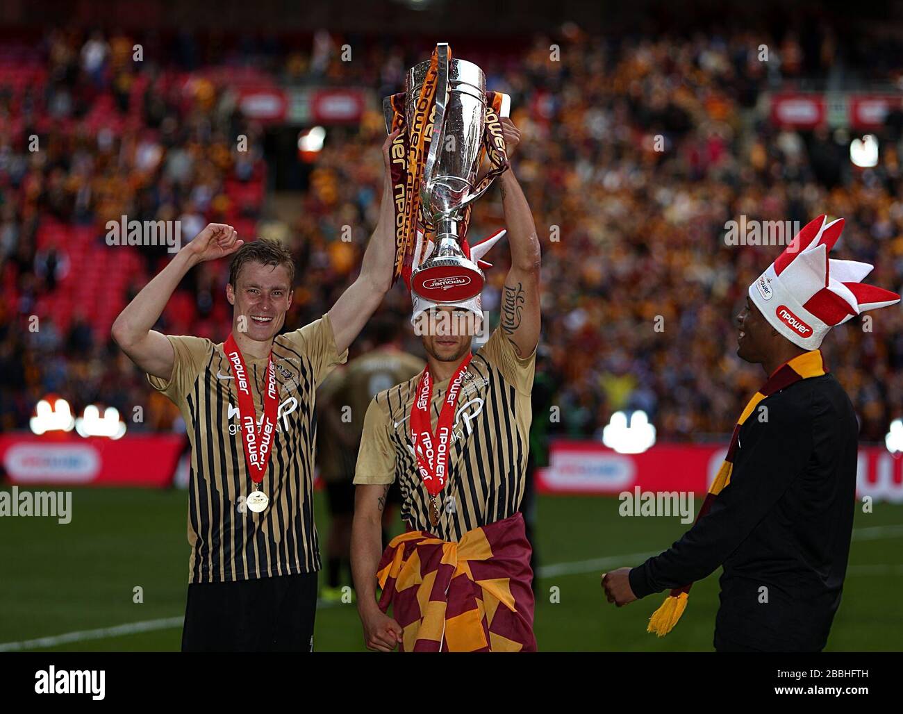 Bradford City's Second and third goal scorers Rory McArdle (left)and Nahki Wells (centre) pose with the npower Football League Two Play-Off Trophy Stock Photo