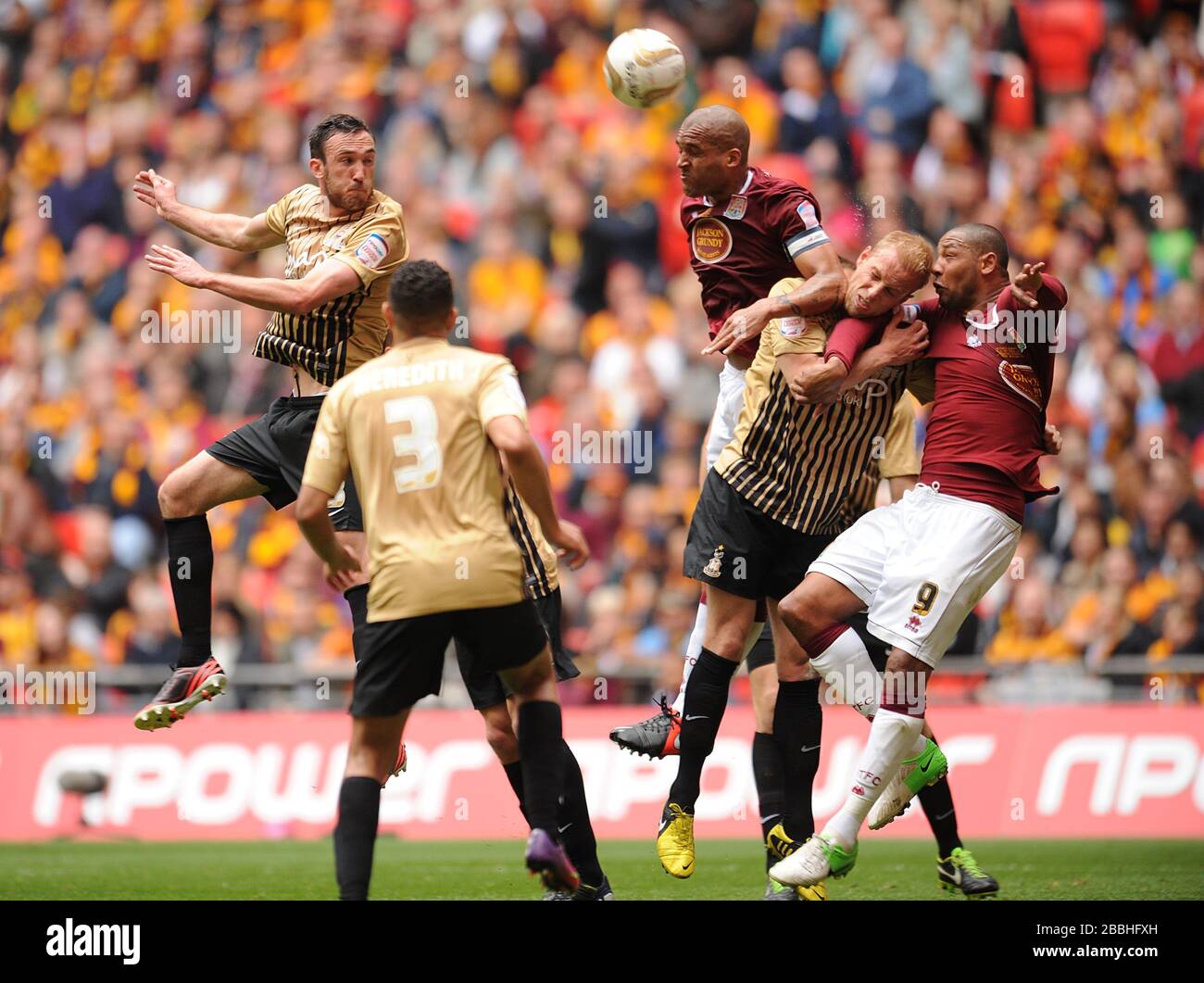 Bradford City's Rory McArdle (left) direct a header on goal Stock Photo Alamy