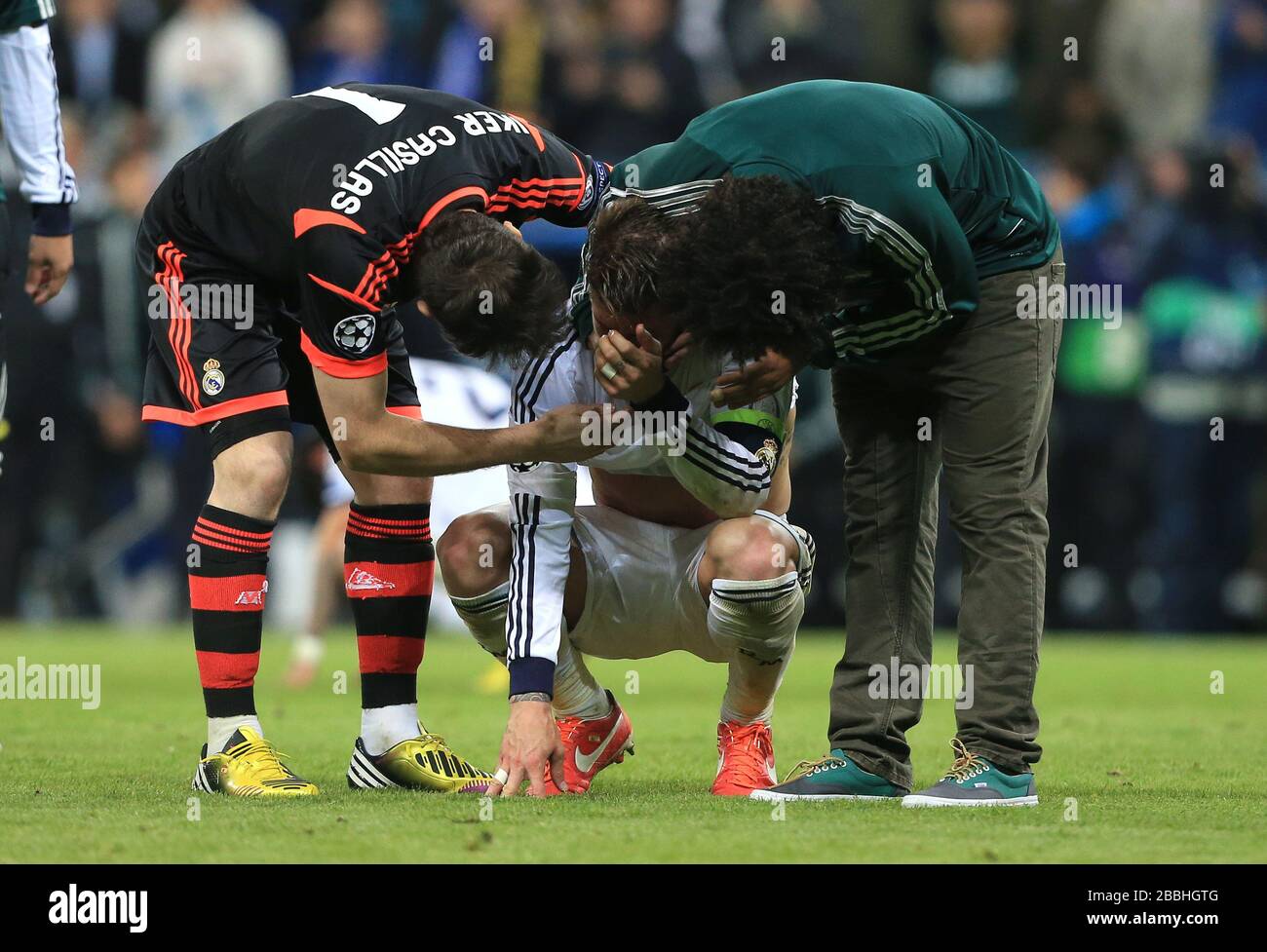 Real Madrid's Sergio Ramos is consoled by Iker Casillas at the end of the game Stock Photo