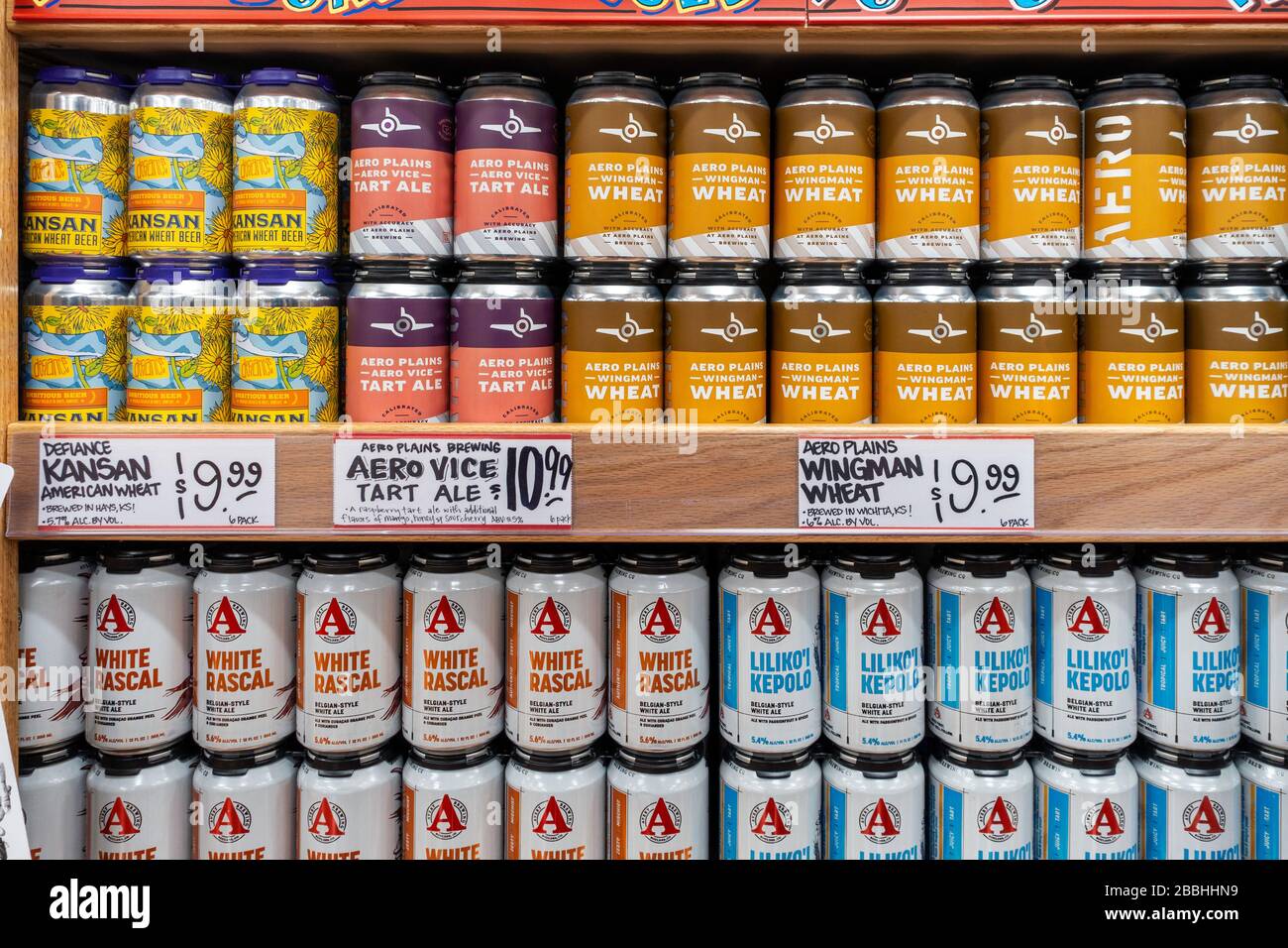 Two shelves of cans of locally brewed craft beers and ales in Trader Joe's, Wichita, Kansas, USA Stock Photo