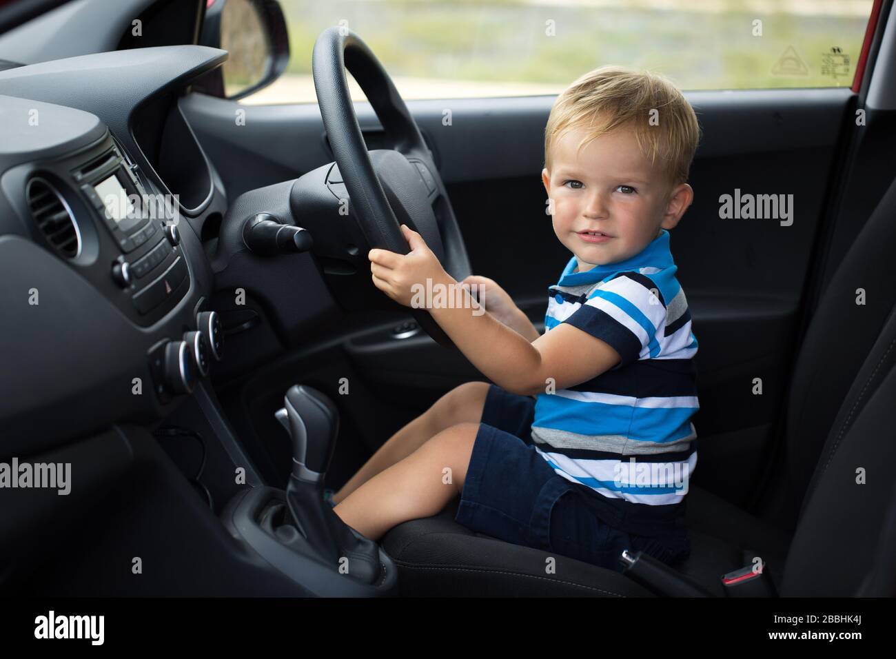 little boy driving