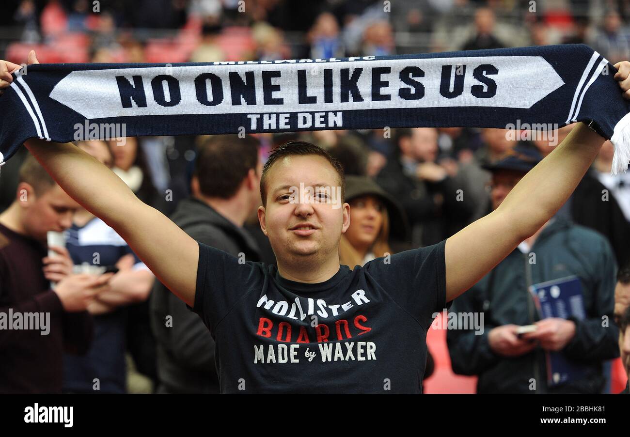 A Millwall fan in the stands with a scarf saying 'No One Likes Us' Stock  Photo - Alamy