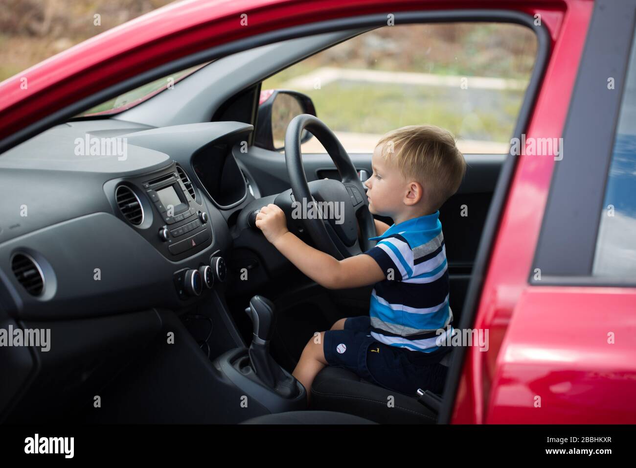 little boy driving