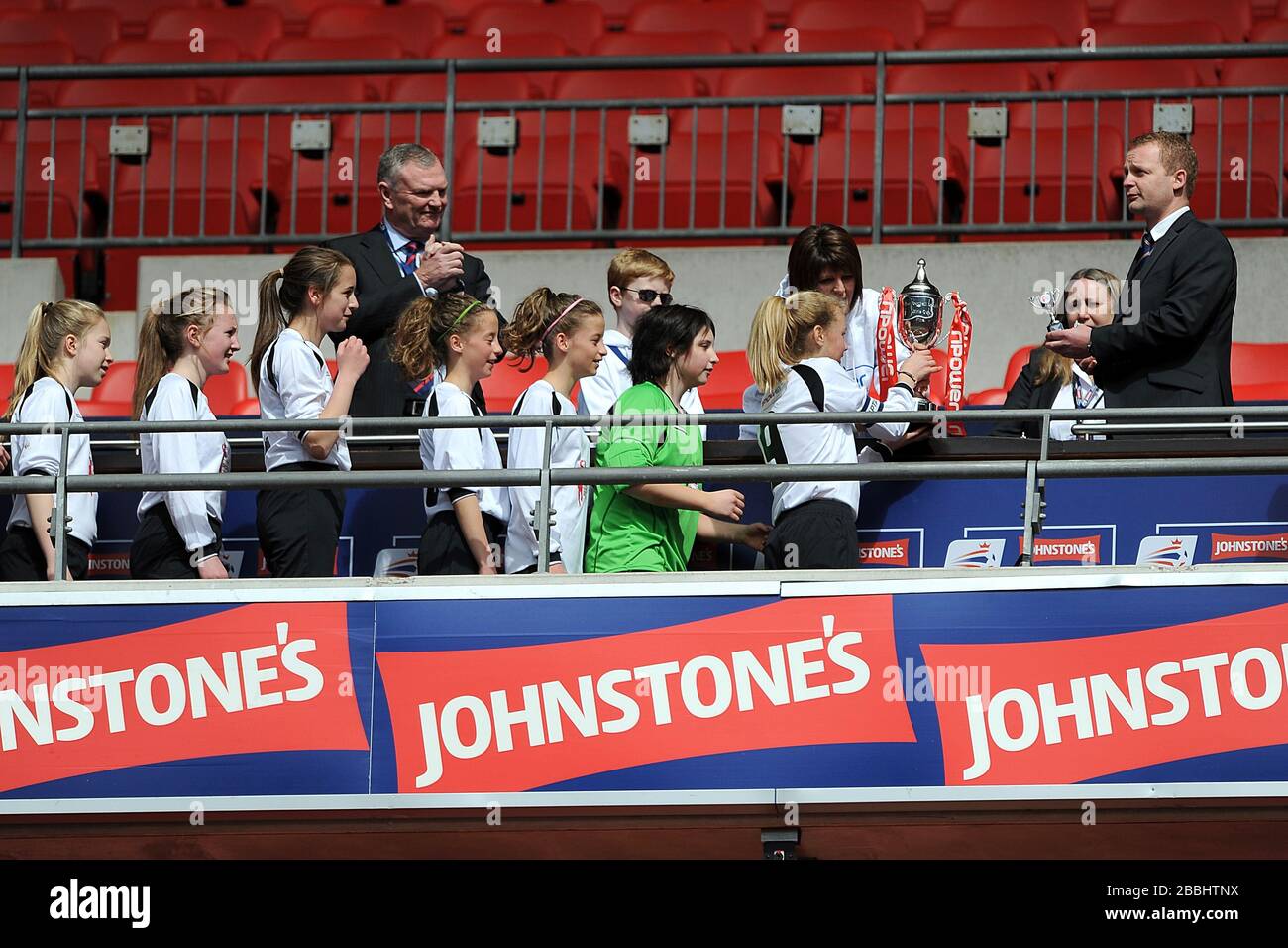 Woodlands School collect the winners trophy following the Football