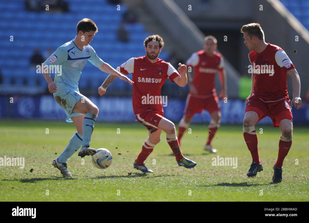 Coventry City's Daniel Philliskirk (left) is challenged by Leyton Orient's Nathan Clarke (centre) Stock Photo