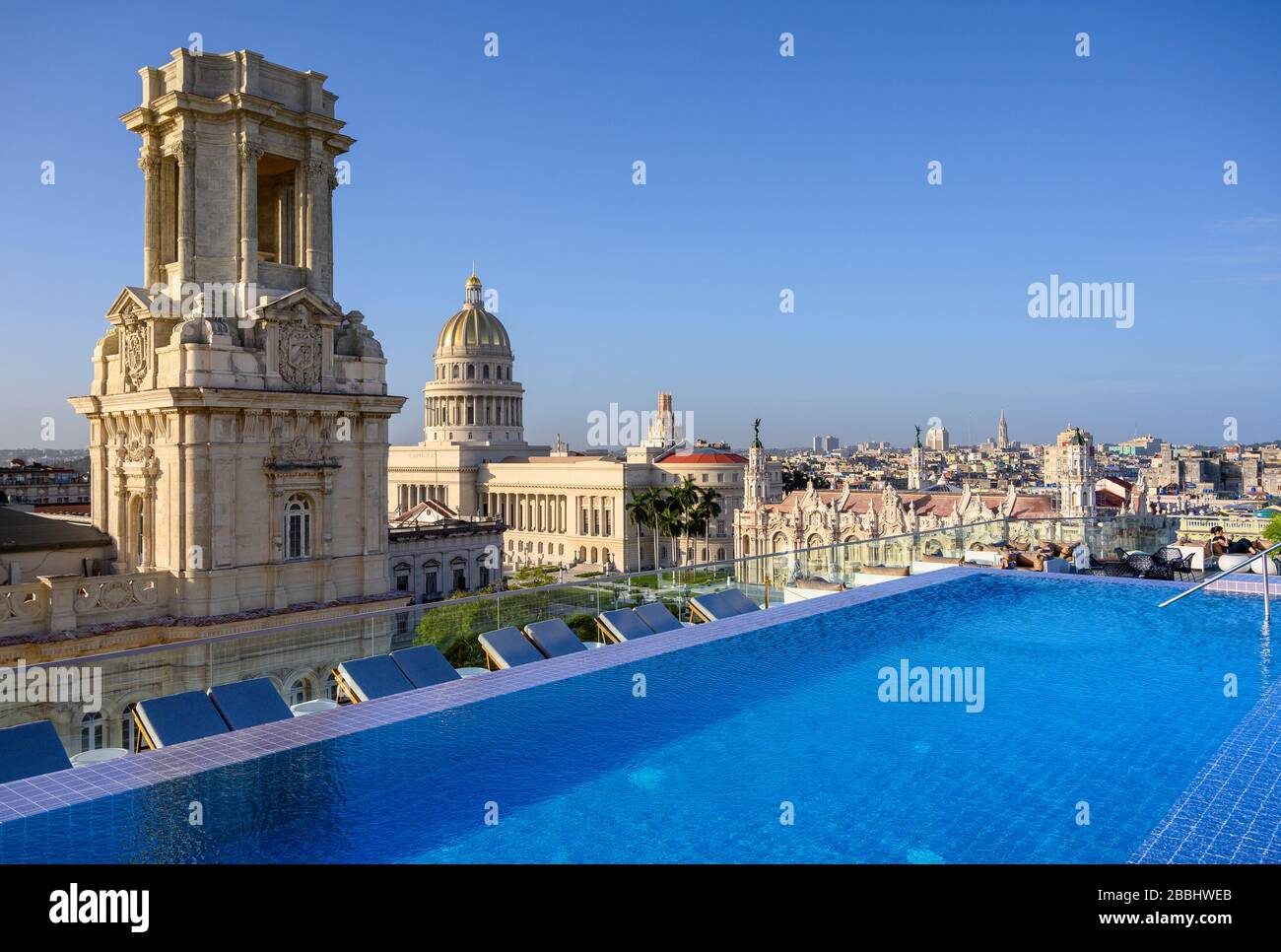 Rooftop view with infinity pool of El Capitolio, or the National Capitol Building, and Museo Nacional de Bellas Artes, from roof of Gran Hotel Manzana Kempinski, Havana, Cuba Stock Photo