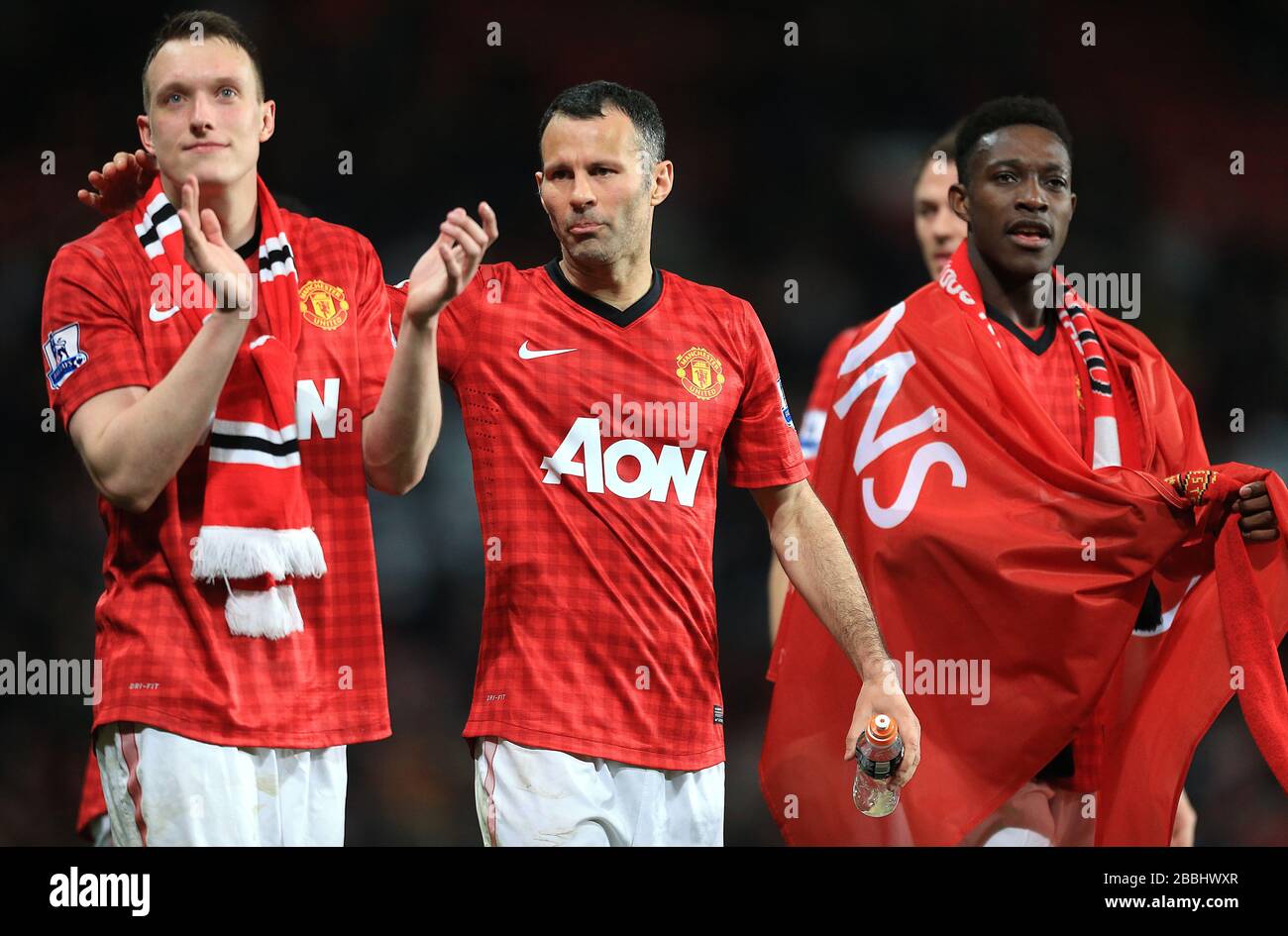 Manchester United Phil Jones, Ryan Giggs and Danny Welbeck celebrate at the clubs 20th league title at the final whistle Stock Photo