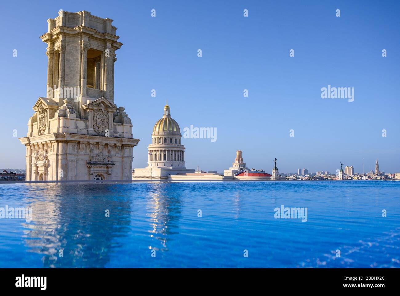Rooftop view with  infinity pool of El Capitolio, or the National Capitol Building, and Museo Nacional de Bellas Artes, from roof of Gran Hotel Manzana Kempinski, Havana, Cuba Stock Photo