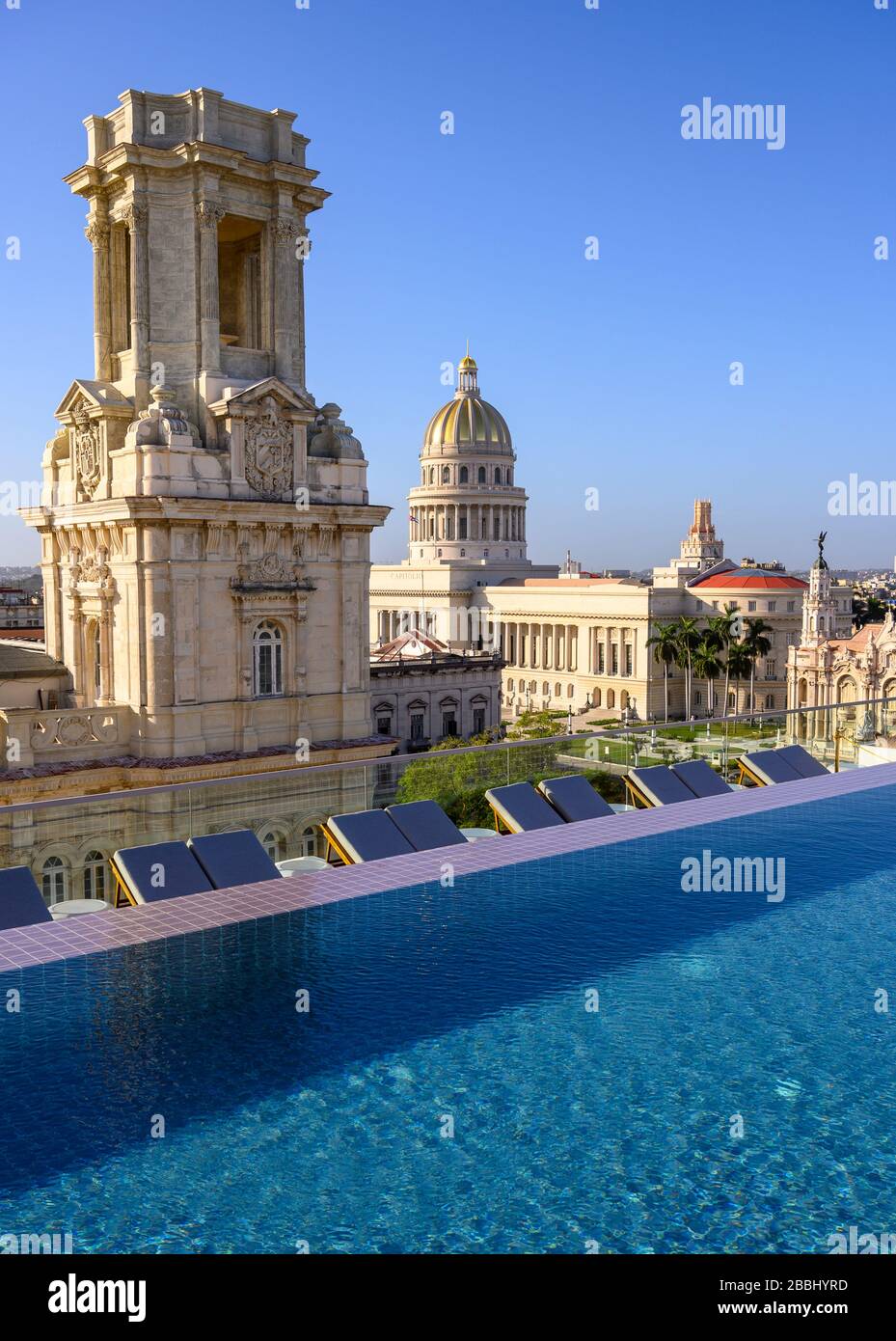 Rooftop view with infinity pool of El Capitolio, or the National Capitol Building, and Museo Nacional de Bellas Artes, from roof of Gran Hotel Manzana Kempinski, Havana, Cuba Stock Photo
