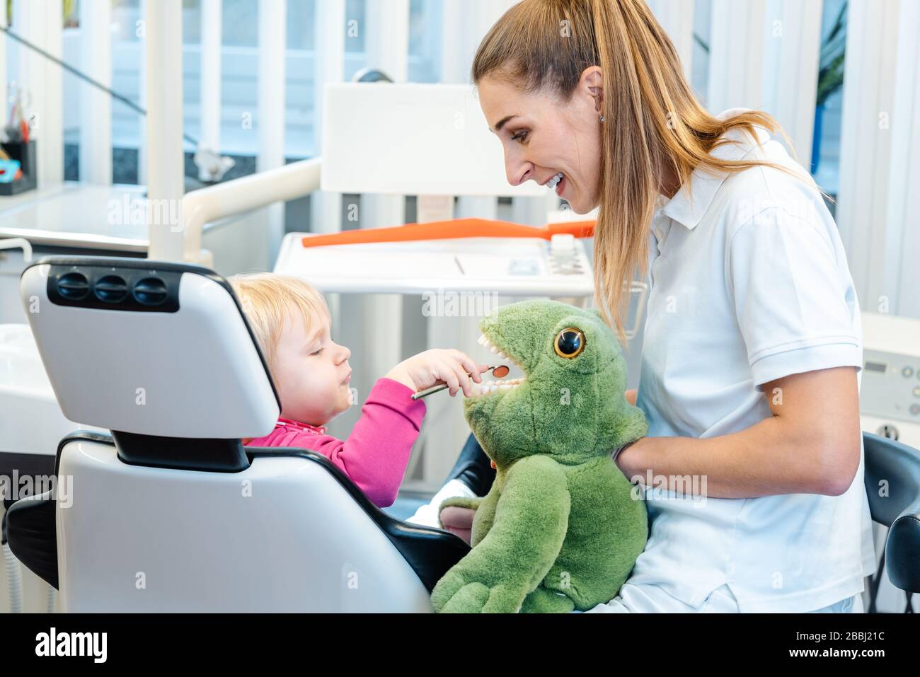 Little child in dentists surgery learning how to brush teeth Stock Photo Alamy