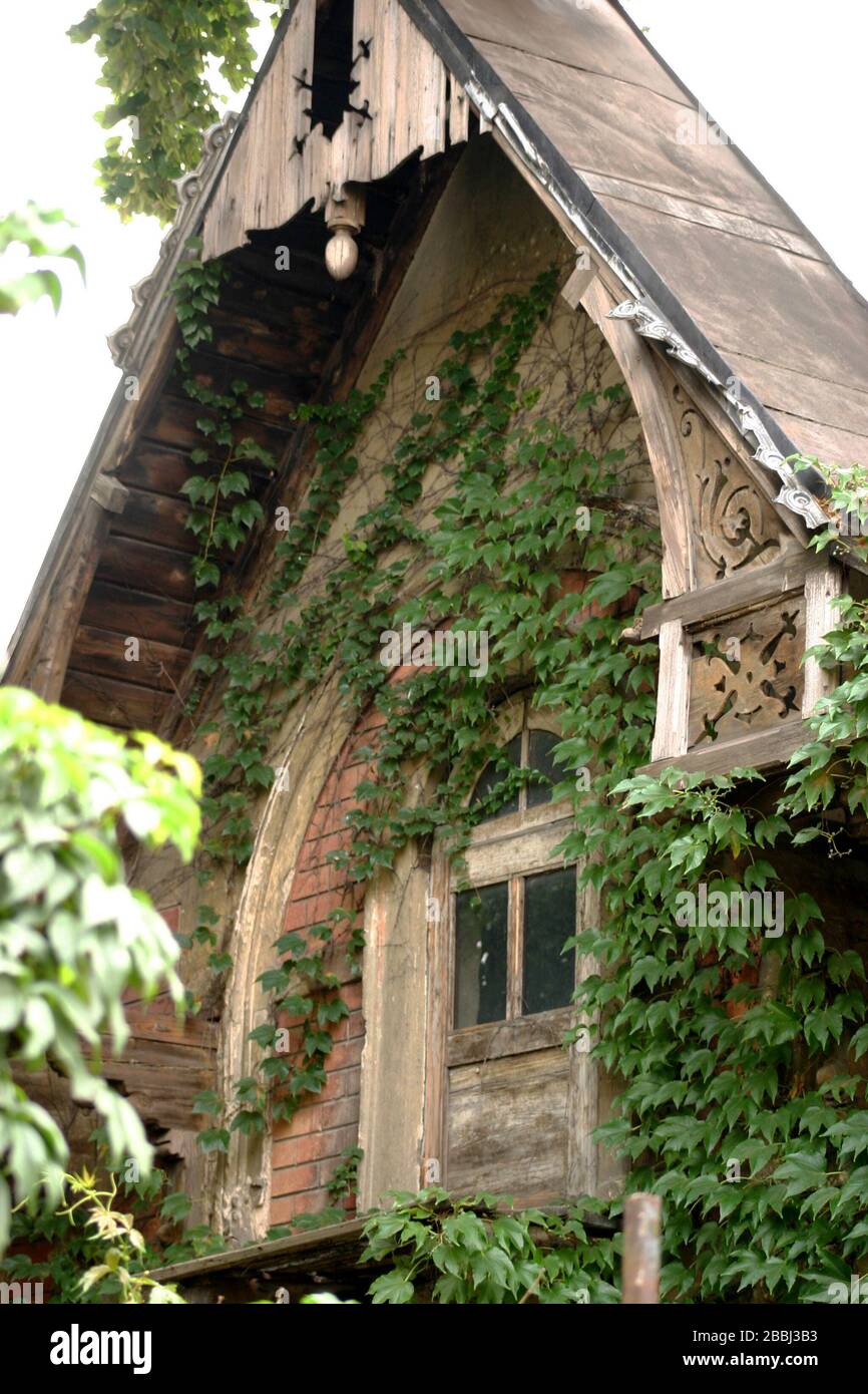 Mansard/ attic window from old house in Bucharest, Romania, covered in
