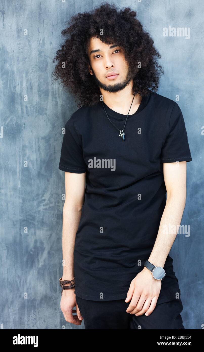 Young black male model posing hi-res stock photography and images - Alamy