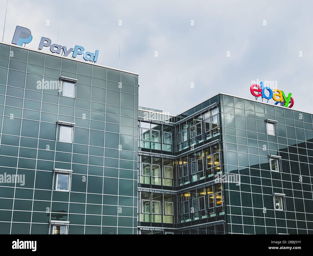 eBay American multinational e-commerce corporation and PayPal American company operating online payments system logo at the companies office building Stock Photo