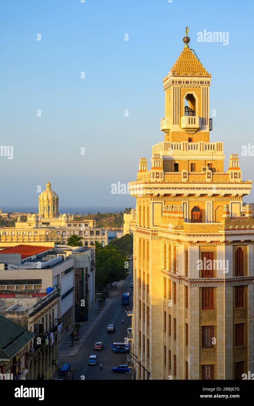 The famous art deco,  Bacardi Building, Edificio Bacardi with the  Museum of the Revolution, formerly the Presidential Palace beyond, Havana Vieja, Cuba Stock Photo