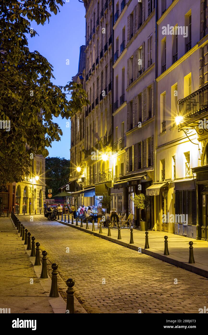 Evening twilight in Place Dauphine on Ile-de-la-Cite, Paris, France Stock Photo