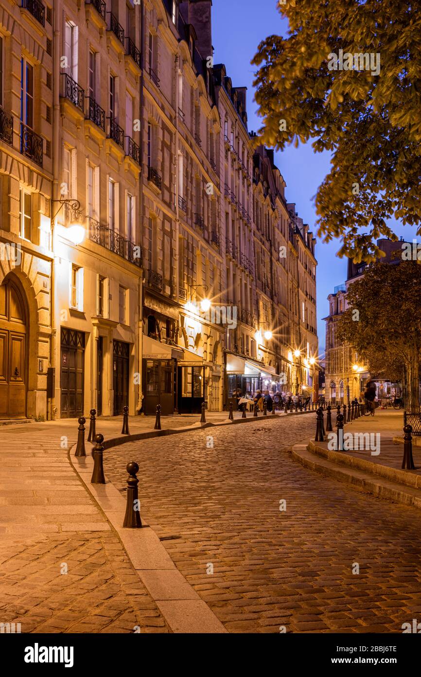 Evening twilight in Place Dauphine on Ile-de-la-Cite, Paris, France Stock Photo
