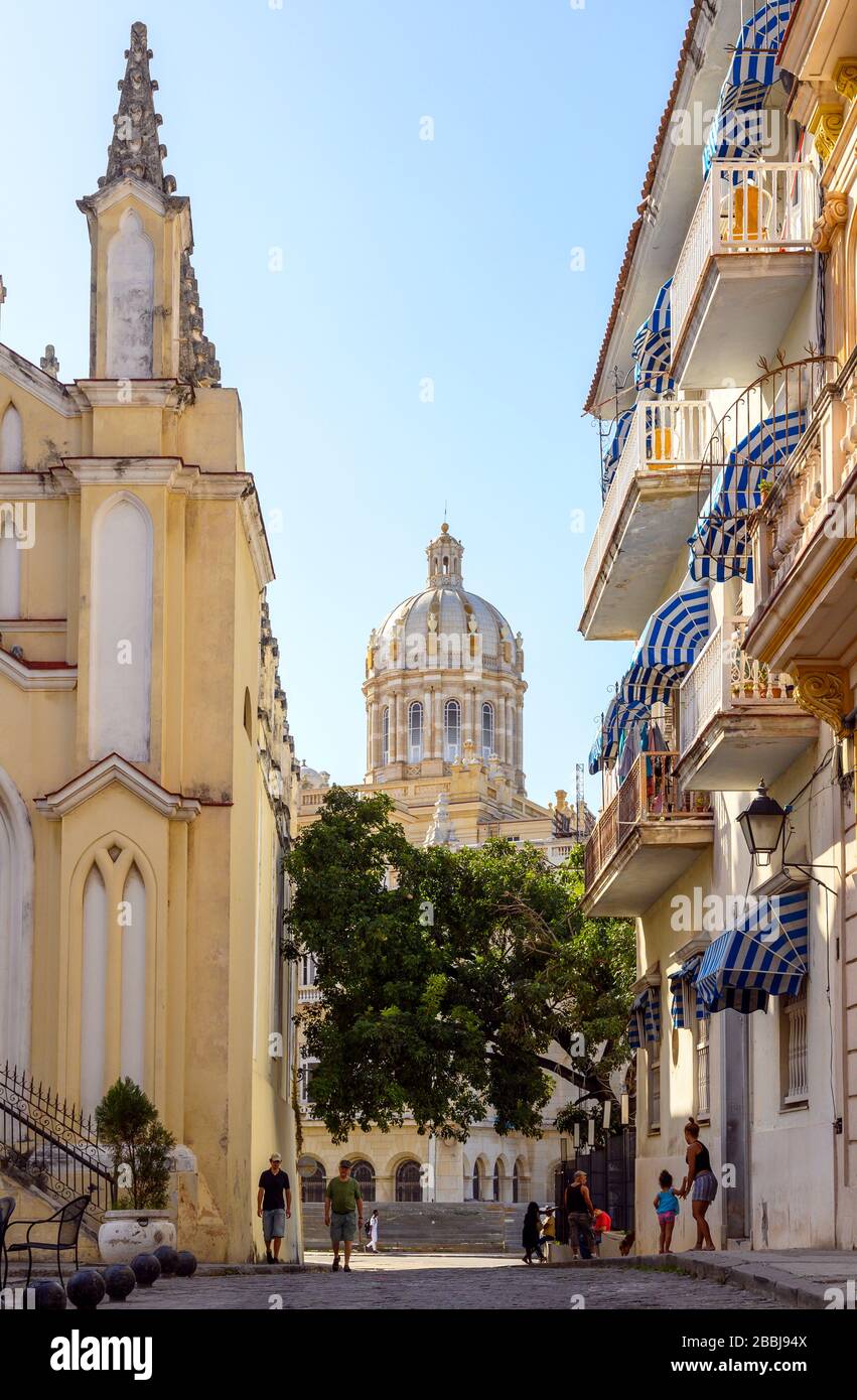 The Museum of the Revolution, formerly the Presidential Palace, with Iglesia del Santo Angel Custodio, on the left foreground,  Havana Vieja,  Cuba Stock Photo