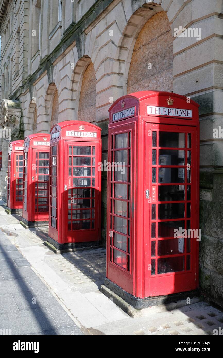 classic English red telephone boxes in a row on blackpool street Stock Photo