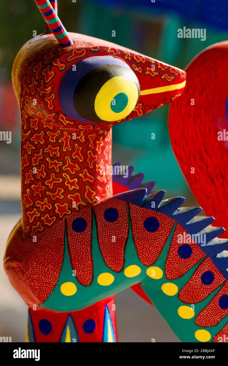 Close up of a colorful copal alebrijes, painted wood animal, created by