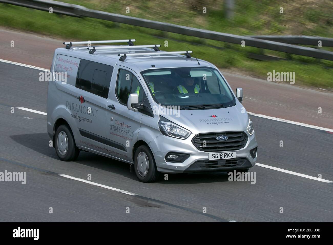 2018 Ford Transit Custom 300 Trend silver lcv driving on the M6 motorway near Preston in Lancashire, UK Stock Photo