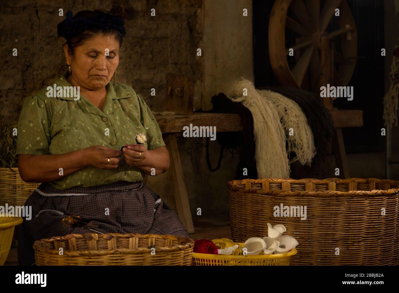 Woman making crafts in her home in the weaving village of Teotitlan Del Valle, Valles Centrales, Oaxaca, Mexico Stock Photo