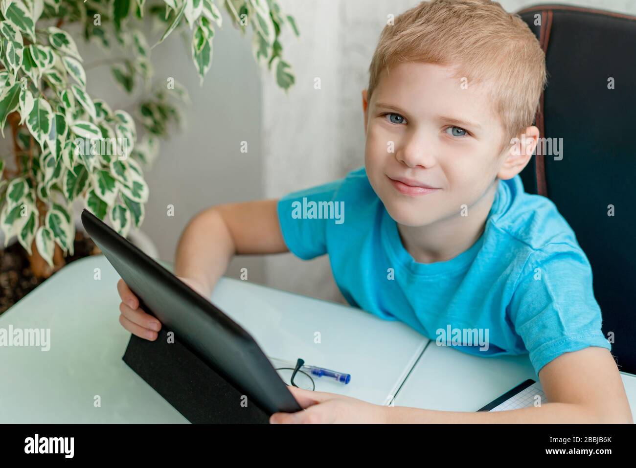 Young boy learn by tablet at home. Distance learning in quarantine ...